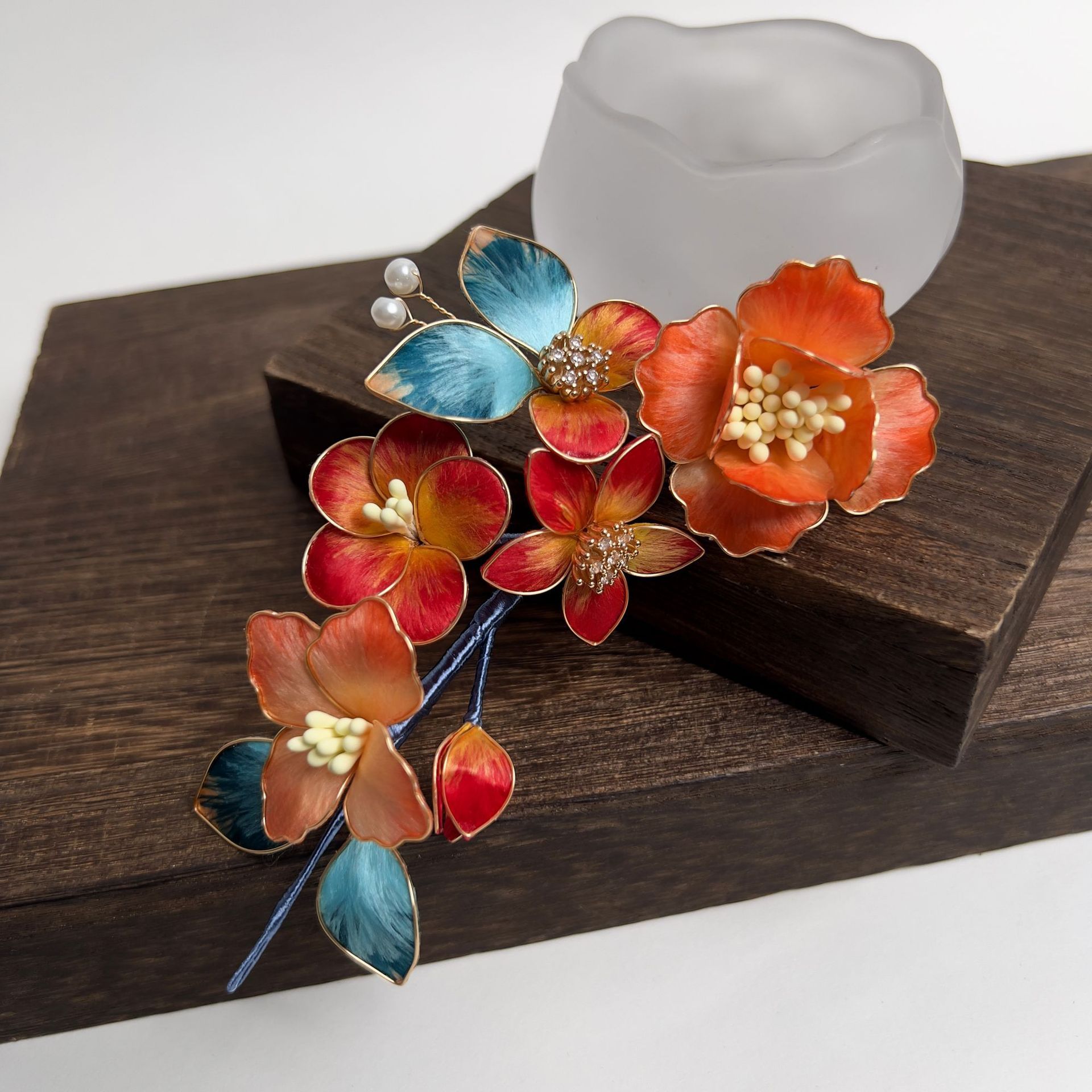 An orange-red floral comb · sample reference photograph